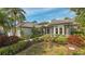 Well maintained house with attractive landscaping and a covered entryway at 1965 White Feather Ln, Nokomis, FL 34275