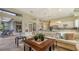 Open living room with a comfortable sectional sofa and pool view at 1965 White Feather Ln, Nokomis, FL 34275