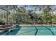 Inviting pool area with spa and screened enclosure, overlooking lush landscaping at 1965 White Feather Ln, Nokomis, FL 34275