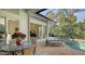 Spacious patio with pool, hot tub, and access to interior living space at 1965 White Feather Ln, Nokomis, FL 34275