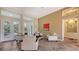 Comfortable sitting area with access to pool and patio at 1965 White Feather Ln, Nokomis, FL 34275