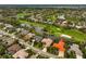 Luxury home on golf course with red tile roof at 2123 Calusa Lakes Blvd, Nokomis, FL 34275
