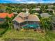 Luxury home with pool and screened lanai, offering waterfront access at 2123 Calusa Lakes Blvd, Nokomis, FL 34275