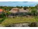 Luxury home with pool and screened lanai, offering waterfront access at 2123 Calusa Lakes Blvd, Nokomis, FL 34275