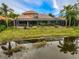 Luxury home with pool and screened lanai, offering waterfront access at 2123 Calusa Lakes Blvd, Nokomis, FL 34275