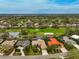 Luxury home on golf course with red tile roof at 2123 Calusa Lakes Blvd, Nokomis, FL 34275