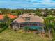 Luxury home with pool and screened lanai, offering waterfront access at 2123 Calusa Lakes Blvd, Nokomis, FL 34275