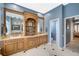 Large bathroom with double sinks, built-in shelving, and a separate toilet area at 2123 Calusa Lakes Blvd, Nokomis, FL 34275