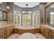Luxurious bathroom with soaking tub, double vanities, and a large walk-in shower at 2123 Calusa Lakes Blvd, Nokomis, FL 34275
