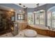 Luxurious bathroom with soaking tub, double vanities, and a large walk-in shower at 2123 Calusa Lakes Blvd, Nokomis, FL 34275