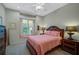 Comfortable bedroom with window seat and neutral decor at 2123 Calusa Lakes Blvd, Nokomis, FL 34275