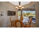 Breakfast nook with table and chairs overlooking the pool area at 2123 Calusa Lakes Blvd, Nokomis, FL 34275
