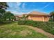 Beautiful home with lush landscaping and a two-car garage at 2123 Calusa Lakes Blvd, Nokomis, FL 34275
