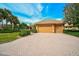 Beautiful home with lush landscaping and a two-car garage at 2123 Calusa Lakes Blvd, Nokomis, FL 34275