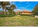 Beautiful home with lush landscaping and a two-car garage at 2123 Calusa Lakes Blvd, Nokomis, FL 34275