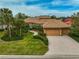 Single Gathering home with tile roof and two car garage at 2123 Calusa Lakes Blvd, Nokomis, FL 34275