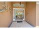 Open front door revealing a view into the interior living space at 2123 Calusa Lakes Blvd, Nokomis, FL 34275