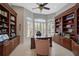 Spacious home office with built-in bookshelves and window seat at 2123 Calusa Lakes Blvd, Nokomis, FL 34275