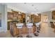 Spacious kitchen with island, granite countertops, and stainless steel appliances at 2123 Calusa Lakes Blvd, Nokomis, FL 34275