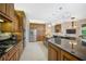 Large kitchen with stainless steel appliances and granite countertops at 2123 Calusa Lakes Blvd, Nokomis, FL 34275