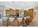 Spacious kitchen with island, granite countertops, and stainless steel appliances at 2123 Calusa Lakes Blvd, Nokomis, FL 34275