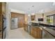 Large kitchen with stainless steel appliances and granite countertops at 2123 Calusa Lakes Blvd, Nokomis, FL 34275