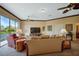 Spacious living room with vaulted ceiling, comfy seating, and a large TV at 2123 Calusa Lakes Blvd, Nokomis, FL 34275