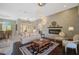 Elegant living room with a chandelier, fireplace and comfortable seating at 2123 Calusa Lakes Blvd, Nokomis, FL 34275