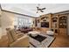 Bright living room with built-in shelving and hardwood floors at 2123 Calusa Lakes Blvd, Nokomis, FL 34275