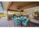 Outdoor kitchen and dining area with a view of the pool table at 2123 Calusa Lakes Blvd, Nokomis, FL 34275