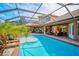 Resort-style pool with a spa and screened enclosure at 2123 Calusa Lakes Blvd, Nokomis, FL 34275