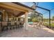 Spacious pool area with a built-in bar and screened enclosure at 2123 Calusa Lakes Blvd, Nokomis, FL 34275