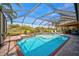 Large, inviting pool and spa with a screened enclosure at 2123 Calusa Lakes Blvd, Nokomis, FL 34275