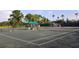Community tennis courts with covered seating at 2123 Calusa Lakes Blvd, Nokomis, FL 34275