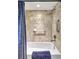 Updated bathroom with tile shower surround, grab bar, and modern fixtures at 2139 Hawthorne St, Sarasota, FL 34239