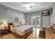 Spacious bedroom with private balcony access and hardwood floors at 2139 Hawthorne St, Sarasota, FL 34239