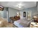 Comfortable bedroom with hardwood floors and ensuite bath at 2139 Hawthorne St, Sarasota, FL 34239