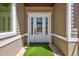 Elegant front door entrance with a welcoming green mat at 2139 Hawthorne St, Sarasota, FL 34239