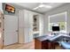 Bright home office with ample built-in storage and hardwood floors at 2139 Hawthorne St, Sarasota, FL 34239