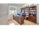 Home office features built-in bookcases and hardwood floors at 2139 Hawthorne St, Sarasota, FL 34239