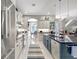 Open concept kitchen with stainless steel appliances and a large island at 2139 Hawthorne St, Sarasota, FL 34239