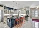 Modern kitchen with a large island, white cabinets, and dark countertops at 2139 Hawthorne St, Sarasota, FL 34239
