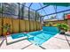 Private pool and spa with a covered patio and seating at 2139 Hawthorne St, Sarasota, FL 34239