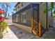 Private screened porch with wood deck and stairs leading to patio at 2139 Hawthorne St, Sarasota, FL 34239