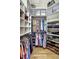 Large walk-in closet with ample shelving and hanging space at 2139 Hawthorne St, Sarasota, FL 34239