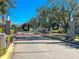 Gated community entrance with security gate and landscaping at 2928 122Nd E Pl, Parrish, FL 34219