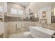 Elegant bathroom with a walk in shower, mosaic tile and modern vanity at 293 Turquoise Ln, Osprey, FL 34229