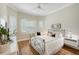 Guest bedroom with a metal bed frame and large window with plantation shutters at 293 Turquoise Ln, Osprey, FL 34229