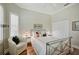 Bright bedroom with a comfortable bed, built in closet and window seat at 293 Turquoise Ln, Osprey, FL 34229