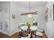 Charming breakfast nook with glass table and view of the backyard at 293 Turquoise Ln, Osprey, FL 34229